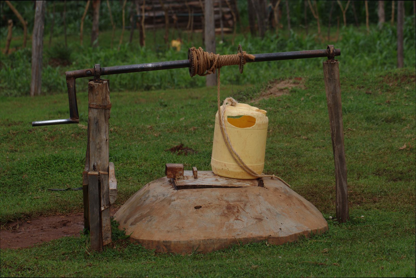 Rustic well with a yellow container in rural Kitale, Kenya