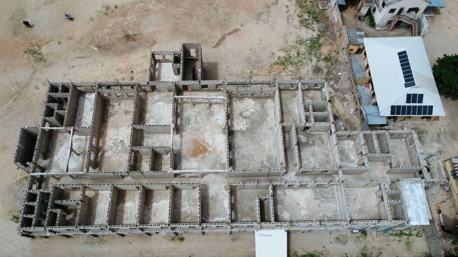 Drone shot of an unfinished concrete building structure in Nigeria