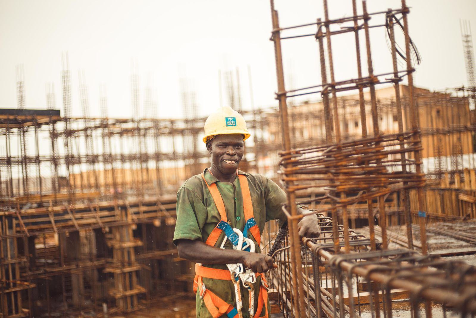Construction worker among steel reinforcement on a building site