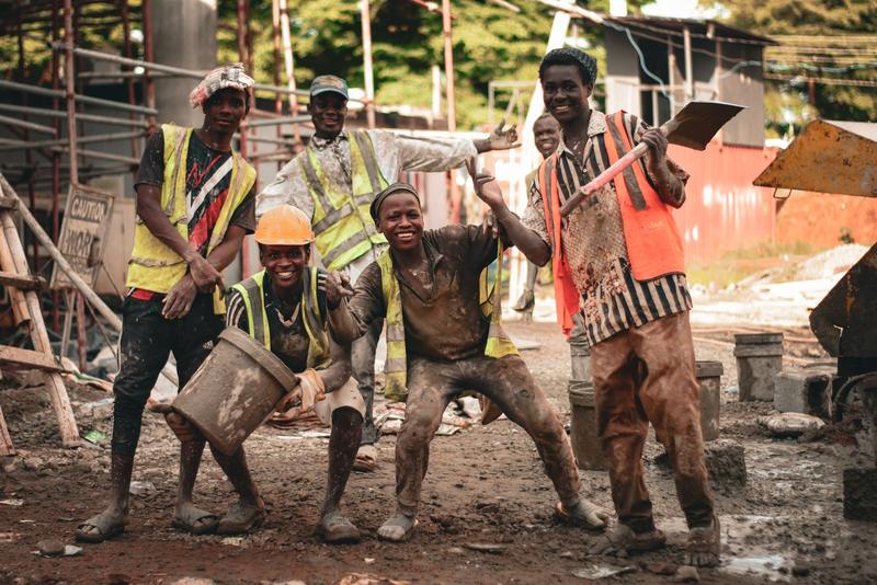 Group of construction workers in safety gear on a building site