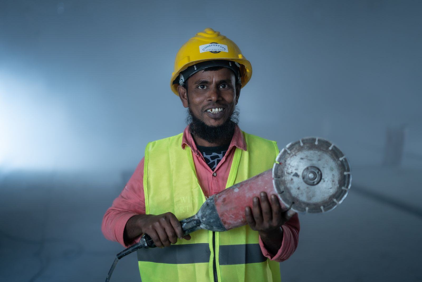 Construction worker wearing a hard hat and high visibility vest