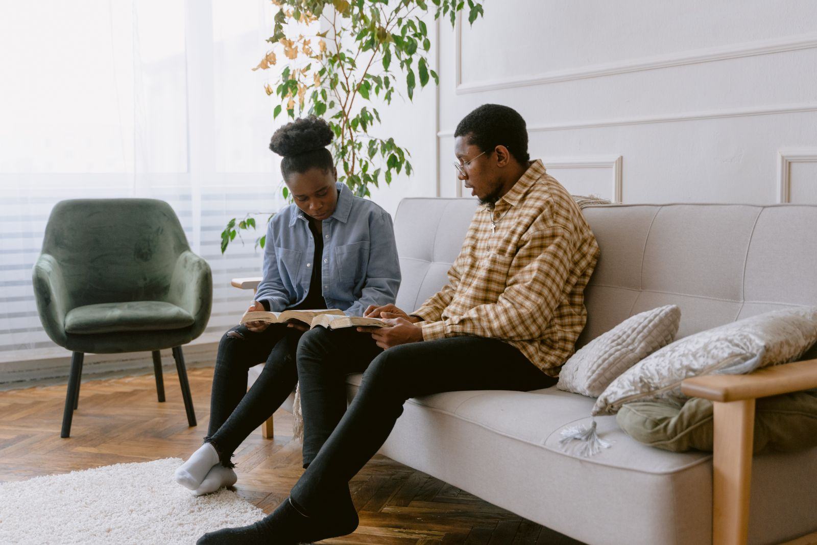 Two people relaxing in a bright living room