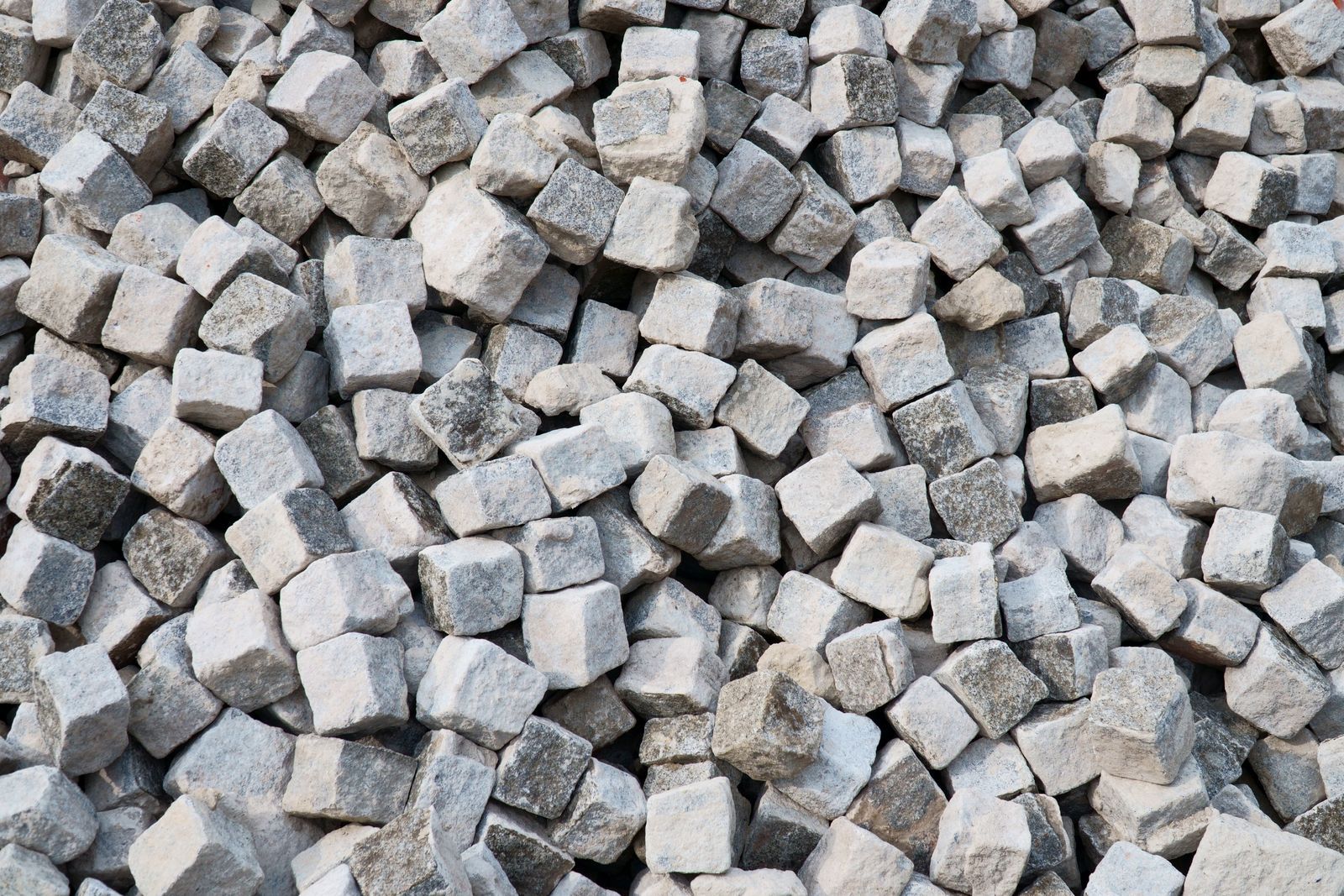 Heap of gray stone cubes
