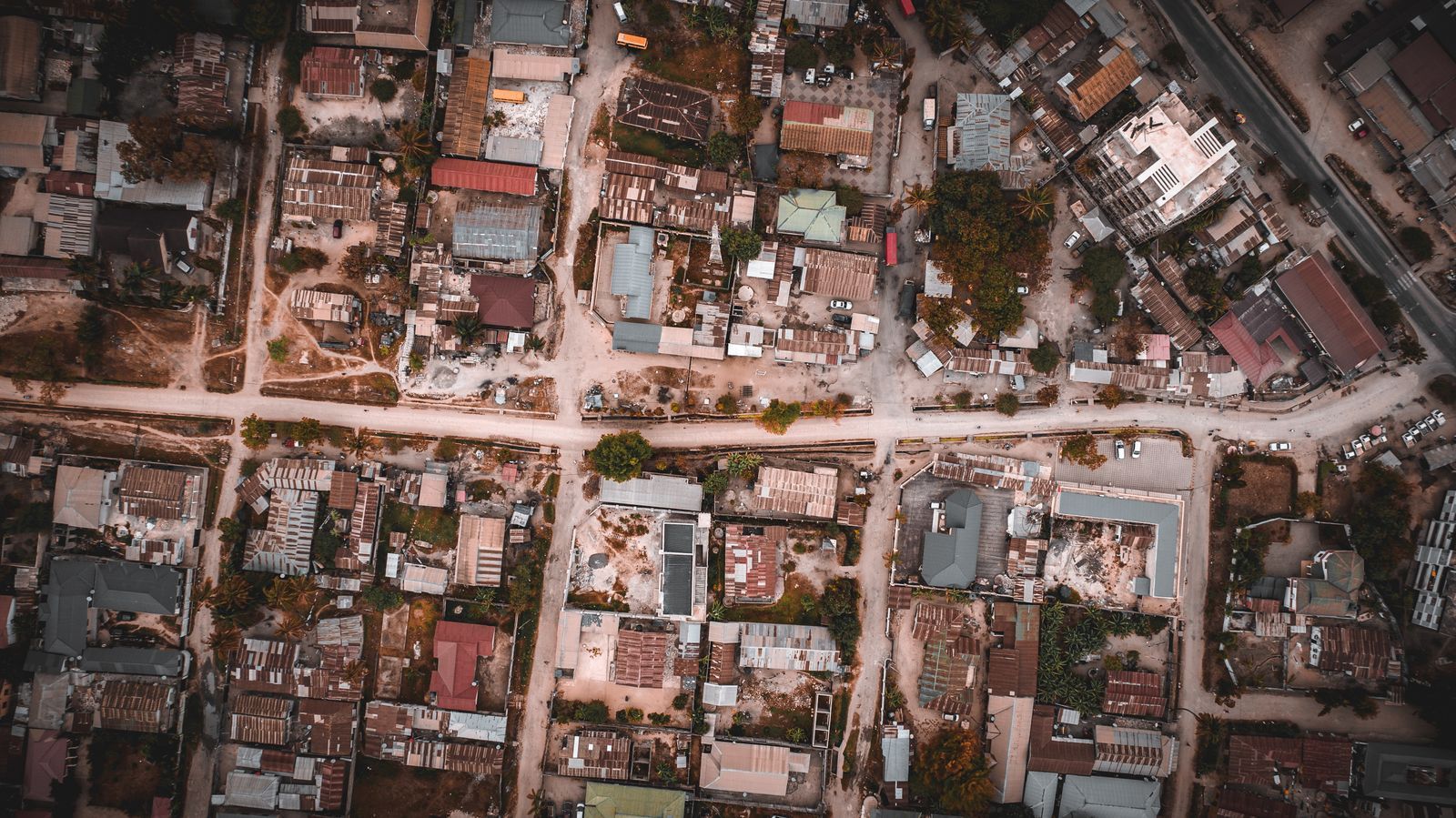 Drone shot of urban streets and buildings in Dar es Salaam, Tanzania