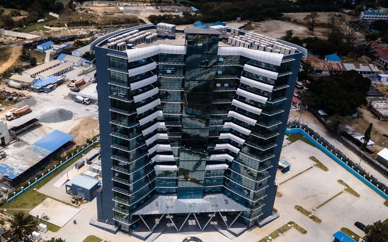 Aerial view of Dar es Salaam with a modern building and busy roads