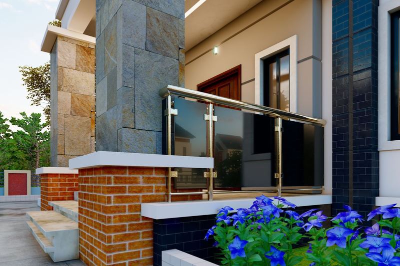 Modern family house entrance with a balcony and garden
